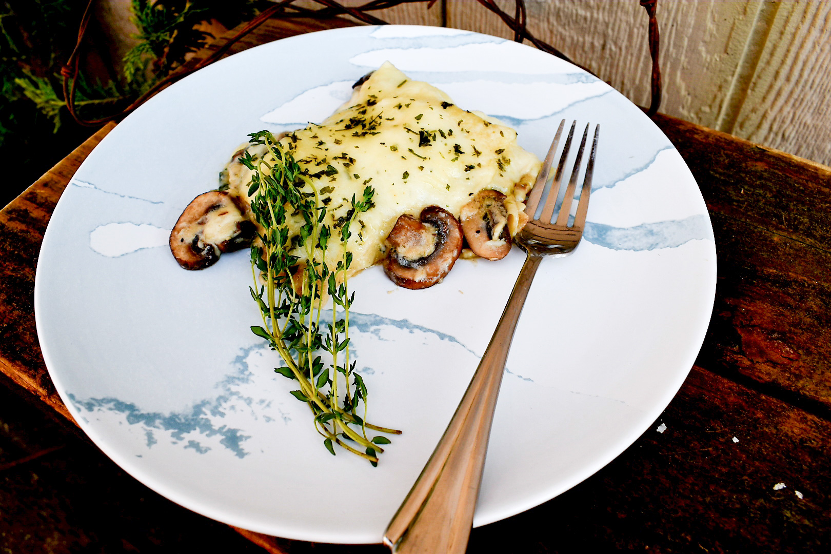 Mushrooms and Greens Lasagna combines layers of creamy mornay sauce with wilted bok choy to create a meatless favorite.