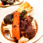 Tender, fall apart, beef chuck braised in rich port wine with carrots and pearl onions over creamy mashed potatoes