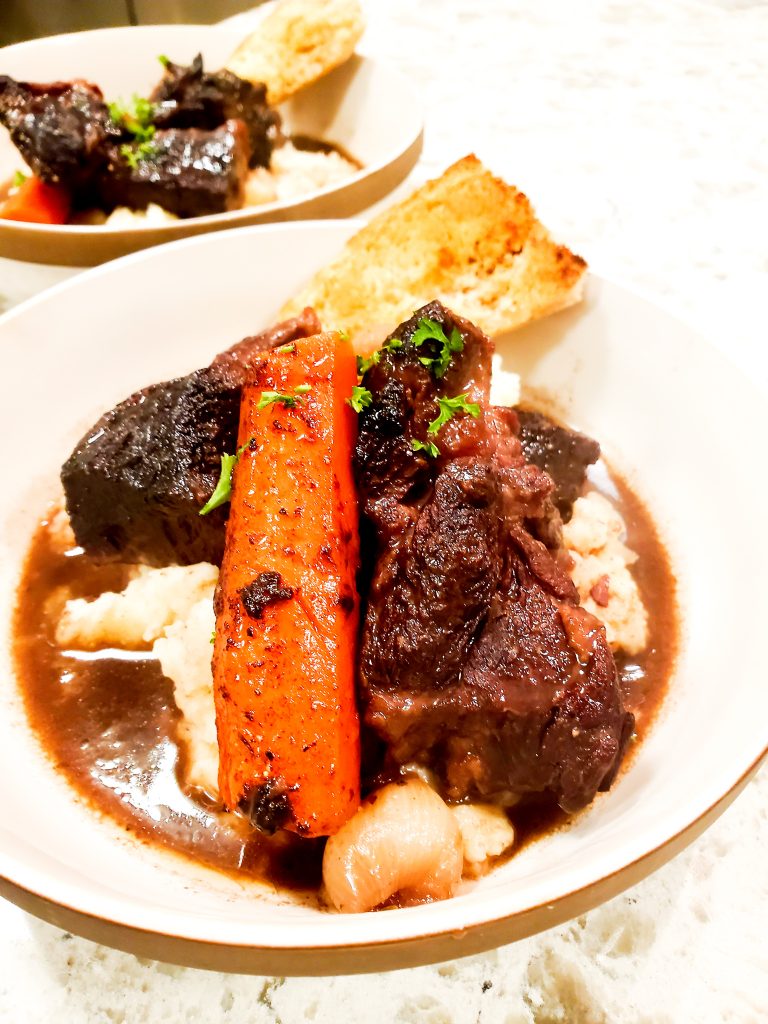 Tender, fall apart, beef chuck braised in rich port wine with carrots and pearl onions over creamy mashed potatoes