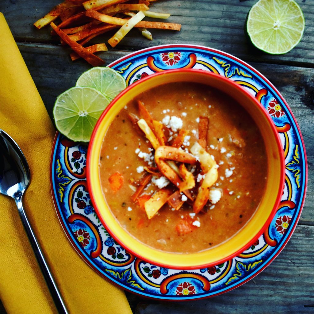 Frijoles Charros are creamy pinto beans are cooked with bacon and chorizo to get that smokey, spicy flavor and a mirapoix of celery, carrot and onion add a richness. Topped with crumbed cotija and crispy fried tortilla strips, you've got a family friendly meal in a bowl.