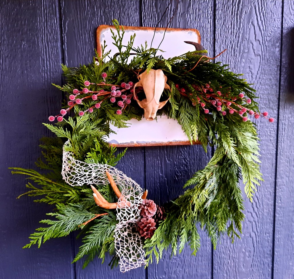 DIY Christmas wreath made from cedar boughs and craft items
