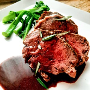 Impress your guests with this easy, but impressive Rosemary Crusted Beef Tenderloin with Port Wine Sauce.