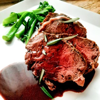 Impress your guests with this easy, but impressive Rosemary Crusted Beef Tenderloin with Port Wine Sauce.