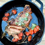 Cast iron seared Rib Steak with Chive Butter and sweet vine tomatoes