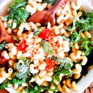 Out West's Lemon Arugula Pasta Salad combines cellentani pasta, arugula, pine nuts and cherry tomatoes in a light lemon vinaigrette dressing.