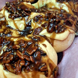 Sticky Pumpkin Pecan Cinnamon Rolls celebrate fall with pumpkin cream cheese frosting and sticky caramel pecan topping.