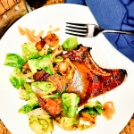Double-Cut Pork Chops with Spiced Agave Mustard Sauce are pan seared and finished in the oven for an extra juicy pork chop.