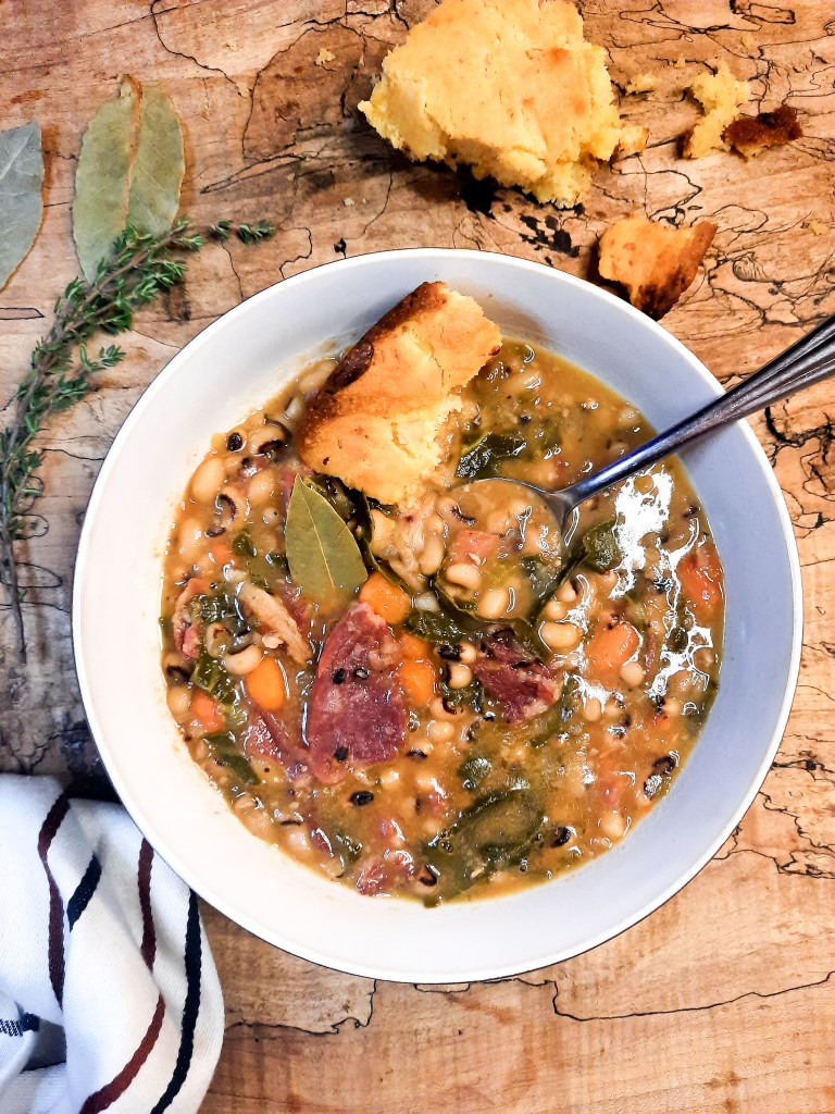 Black Eyed Pea Soup with smoked ham and collard greens in a flavorful broth.