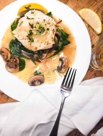 Roasted Cod with Spinach and Mushrooms is a light and simple weeknight dinner with an easy to make lemon shallot sauce