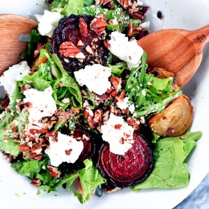 Roasted Beet Salad with Goat Cheese and Pecans combines slices of roasted red and yellow beets with goat cheese, greens and toasted pecans in a shallot vinaigrette.