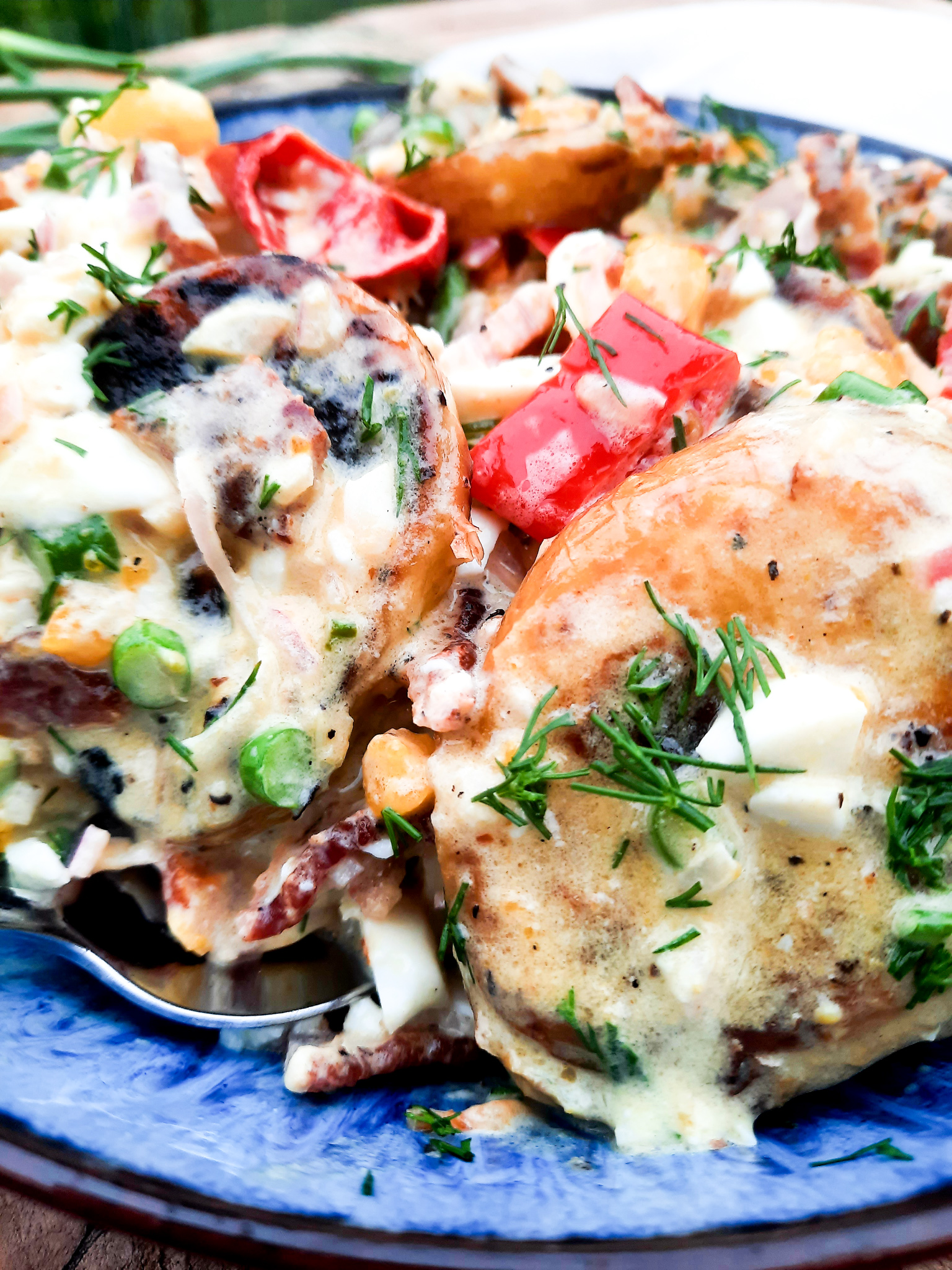 Grilled Potato Salad with Shallot Vinaigrette is a flavorful addition to your table with fresh herbs, bacon, chopped egg and pickled peppers.