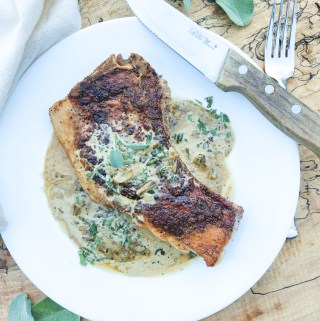 Pan Seared Pork Chops with Sage Cream Sauce utilizes a cast iron pan to created a juicy chop with a seasoned crust and a delicious pan sauce.