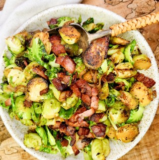 Bacon-Shallot Brussels Sprouts are seared in bacon fat, splashed with sherry wine and seasoned with salt and pepper for a delicious side dish.