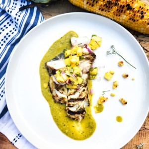 Grilled Sablefish with Roasted Poblano Vinaigrette is light, buttery and topped with a sweet and spicy pineapple salsa.