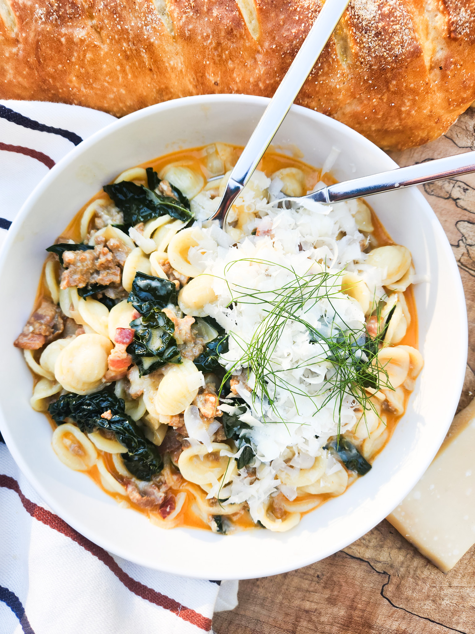 Orecchiette Pasta with Chorizo and Kale is creamy, saucy and packed with bits of bacon, shallot and freshly shaved parmesan.