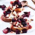 Creamy Smoked Beet Toast with goat cheese, toasted pecans and balsamic hot honey drizzle on sourdough toast.