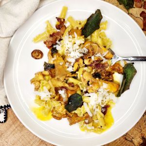 Chanterelle Campanelle Carbonara with foraged chanterelles, crispy fried sage and bacon in a creamy parmesan egg sauce.