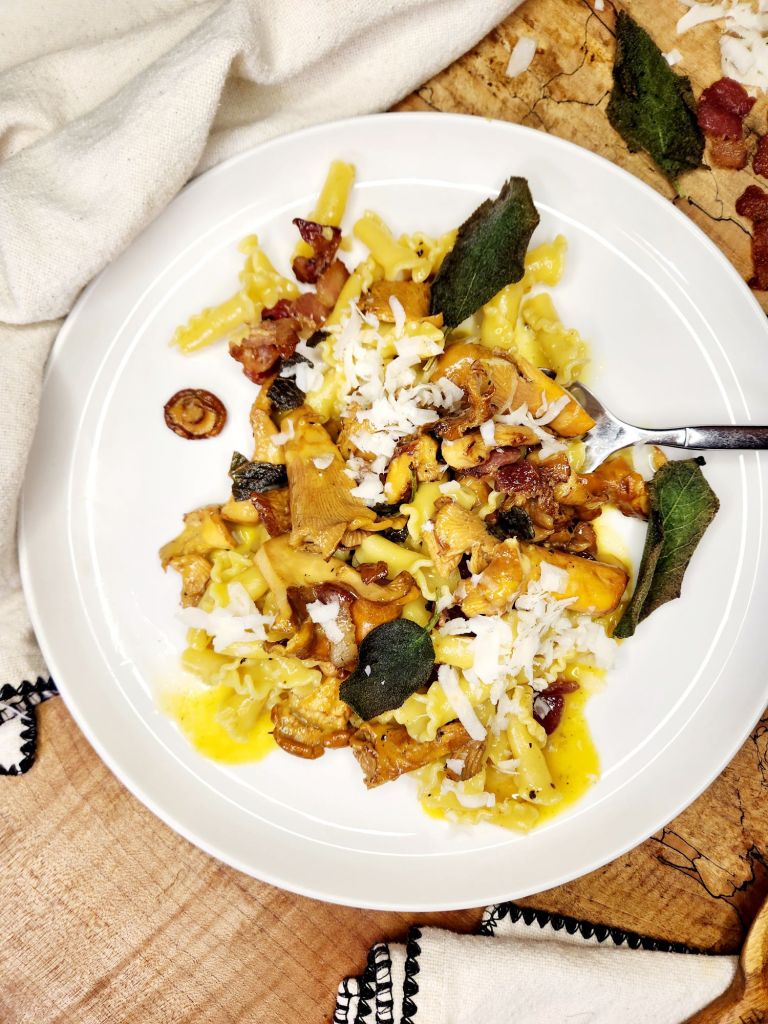 Chanterelle Campanelle Carbonara with foraged chanterelles, crispy fried sage and bacon in a creamy parmesan egg sauce.