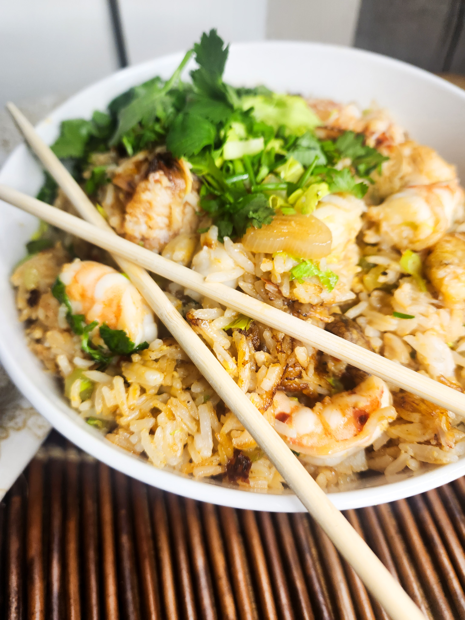 Seafood Fried Rice layers Dungeness crab, sea scallops and shrimp together with fresh herbs for a quick weeknight meal.