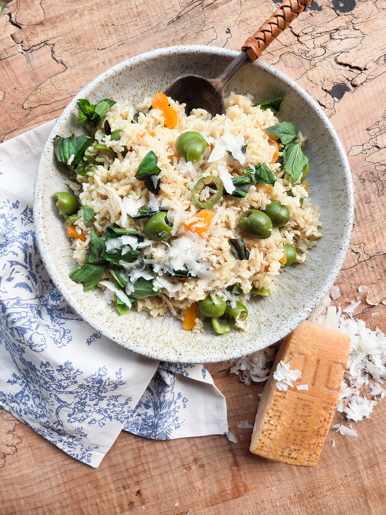 Mediterranean Rice with Castelvetrano olives, dried apricots, pine nuts, fresh basil, parmesan and brown rice.