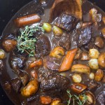 Beef Bourguignon is a classic made famous by Julia Child with seared and stewed beef, carrots, mushrooms and pearl onions in a red wine base.
