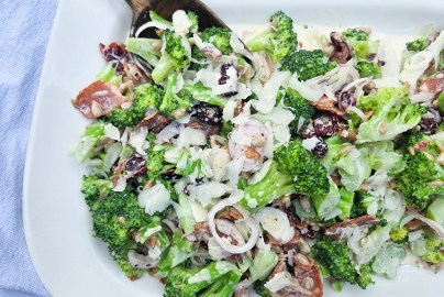 Modern Broccoli Salad is an updated version of the classic with shallots, bacon, cranberries, sunflower seeds and Pecorino cheese.