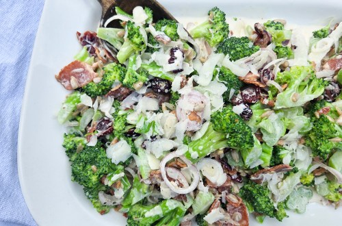 Modern Broccoli Salad is an updated version of the classic with shallots, bacon, cranberries, sunflower seeds and Pecorino cheese.