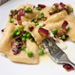 Lemon Ricotta Ravioli with Bacon and Peas is made from scratch coated in a white wine, garlic butter sauce.